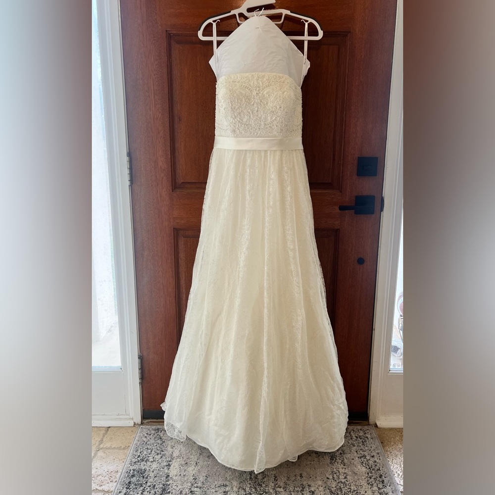 Oleg Cassini Collection Wedding Dress. Ivory in color. Size 6